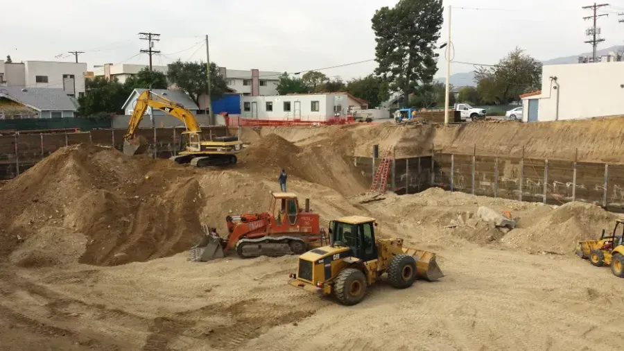 Los Angeles hillside construction site showing grading and excavation work for a residential project